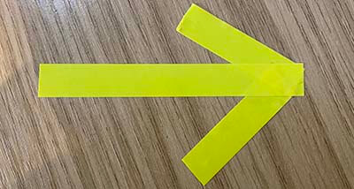 Brother TZ tape in an arrow shape