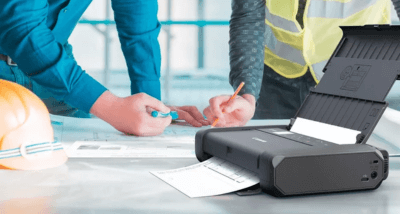 Canon MAXIFY BX110 being used inside a construction office