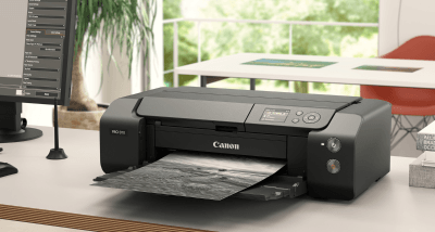 Canon imagePROGRAF PRO-310 on a desk in creative studio