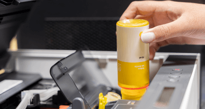 Yellow ink tank being refilled