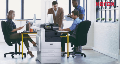 xerox-pagepack-office Office workers sat around a Xerox PagePack printer